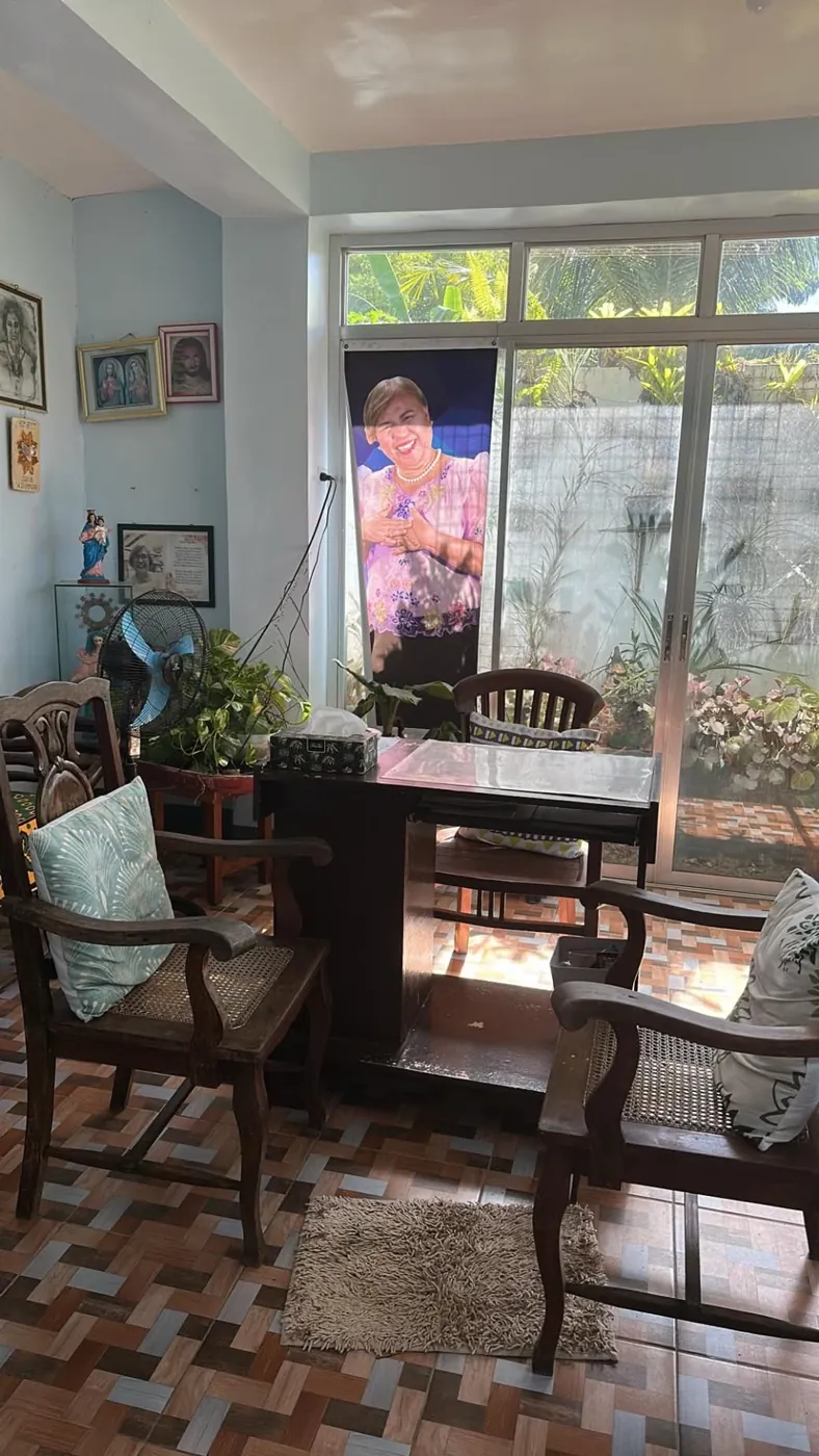 Clinic seating area with a portrait banner of Dr. Molon